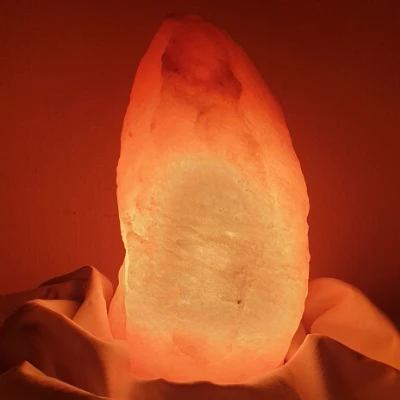 Close-up of glowing Himalayan salt lamp showing bands and fissures