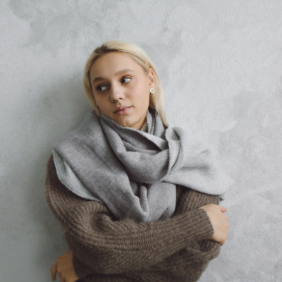 Soft pashmina scarf draped on a young woman