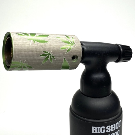 Engraved butane torch guard with pot leaf design