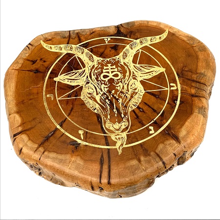 Driftwood with laser-engraved and painted goat head design