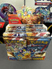 Pokémon Scarlet & Violet Surging Sparks booster packs fresh from a factory-sealed box at T206 Cards