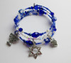 A special bracelet celebrating the traditions of Hanukkah! Deep blue beads evoke the eight nights of the festival.  Crystals symbolize the flames of the menorah.