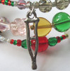 A Christmas Carol Bracelet detail: "A crutch without an owner, lovingly preserved..."
