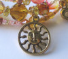 The sun charm is symbolic of Brunnhilde's greeting to the light.