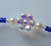 Mimi Bracelet inspired by La Boheme. Detail: Flower bead.
