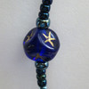 Queen of the Night Bracelet bead detail: cobalt pressed glass with impressed gold stars