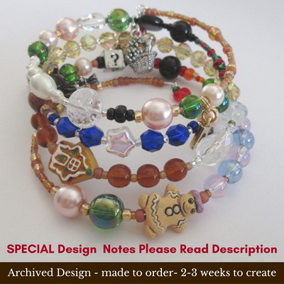 View of the bracelet highlighting the gingerbread house and woman beads.