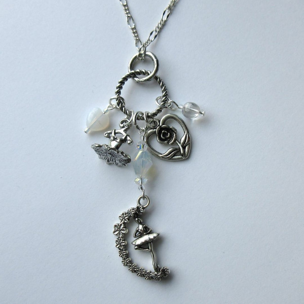 The Ballet Lover's Necklace celebrates this artform with a tutu charm, heart with flower charm, plus a unique spinning ballerina charm! A perfect gift for ballet fans.