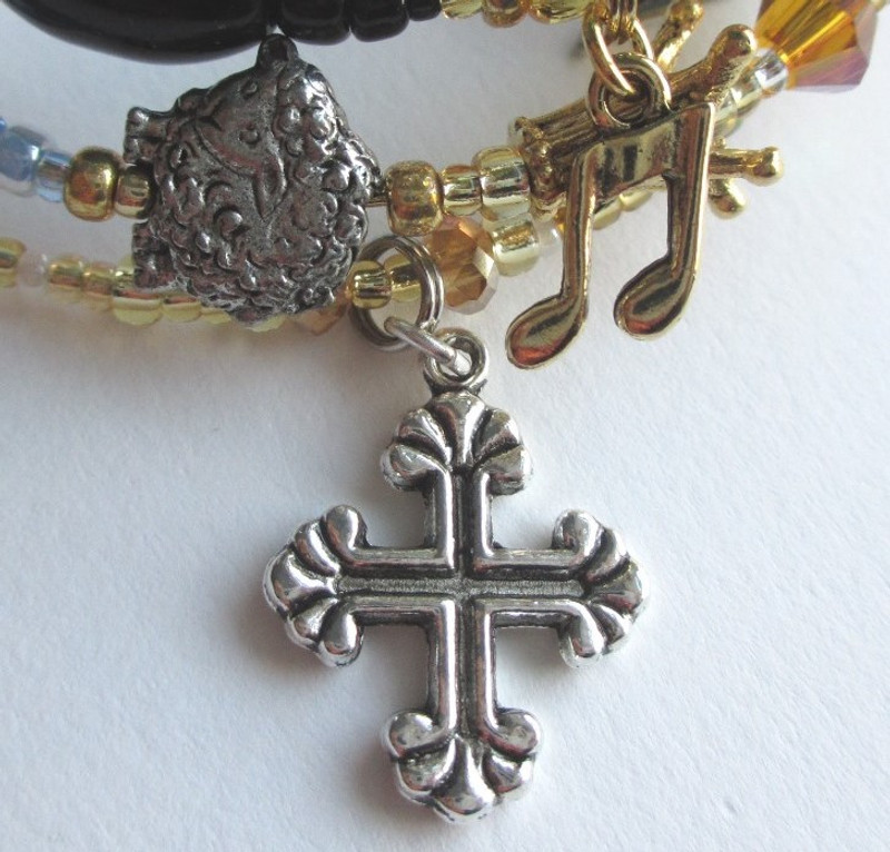 The Handel's Messiah Bracelet detail: The fancy cross symbolizes the final "Amen".