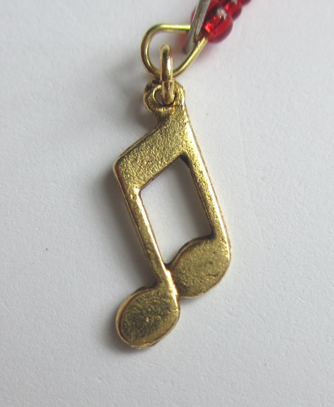 The well known waltz for Puccini's La Boheme is represented by a music note charm.