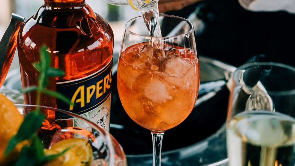 https://cdn11.bigcommerce.com/s-27kywurgdp/images/stencil/960x540/uploaded_images/aperolspritz.png?t=1685634922