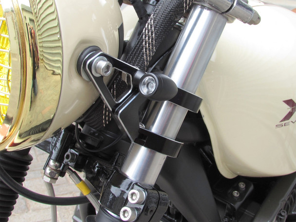 hinged motorcycle headlight bracket