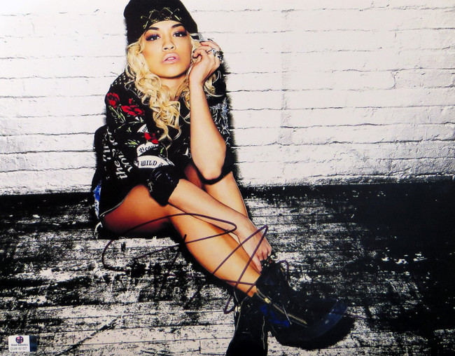 Rita Ora Signed Autographed 11X14 Photo Sexy Sitting Brick Wall GV816157