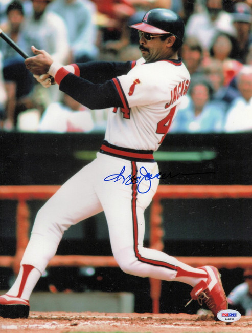 FILE: Reggie Jackson of the California Angels signing an autograph for a  fan before the game. (Sportswire via AP Images Stock Photo - Alamy