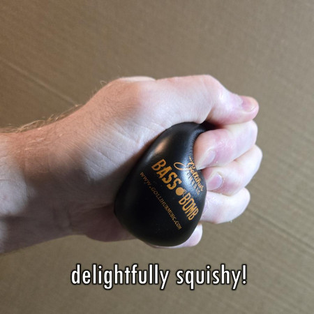 Bass Bomb - Feedback Fighting Resonance Reducer being squeezed in a person's hand - text: "delightfully squishy"
