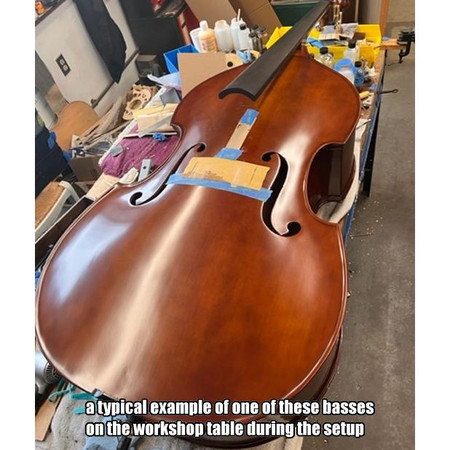 John Juzek Carved Double Bass, on bench during setup (long view) - model 400