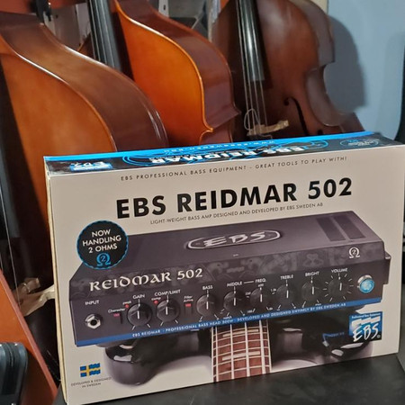 EBS Reidmar 502 Amplifier Head, in box, in front of upright basses