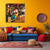 Colorful canvas art of Coco the Parrot hanging above a bold yellow and blue couch in a brightly decorated living room, bringing tropical vibes and island flair to the decor.