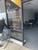 Cosmetology school storefront window decal with bold black and gold design. Reads "Become your own boss! Start your career in Cosmetology" with phone number and website. Custom business window graphics for beauty salons, spas, and training academies.
