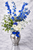 Mirrored sophisticated arrangement with blue elegant blue delphiniums