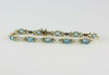 10K YG 7ct tw Blue Topaz and Diamond Accent Bracelet 7.75 Inches