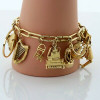 Massive Charm Bracelet set in 14K Yellow Gold Worldwide and Whimsey