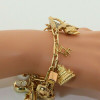 Massive Charm Bracelet set in 14K Yellow Gold Worldwide and Whimsey