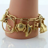 Massive Charm Bracelet set in 14K Yellow Gold Worldwide and Whimsey