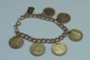 14K Yellow Gold 7 inch Bracelet w/Euro Coins and Gold Charms.