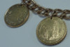 14K Yellow Gold 7 inch Bracelet w/Euro Coins and Gold Charms.