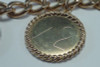 14K Yellow Gold 7 inch Bracelet w/Euro Coins and Gold Charms.