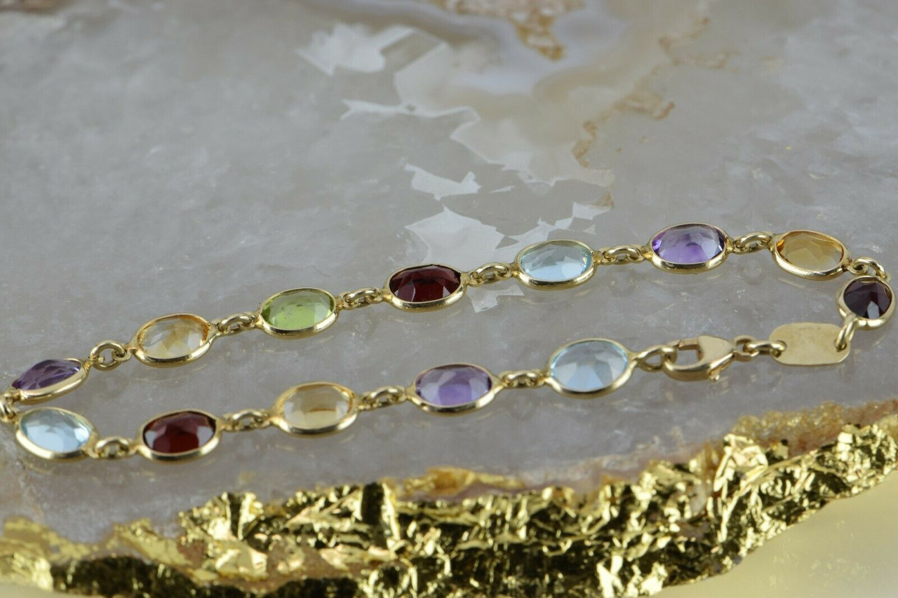 Bracelet with multi-colored gems in Gold