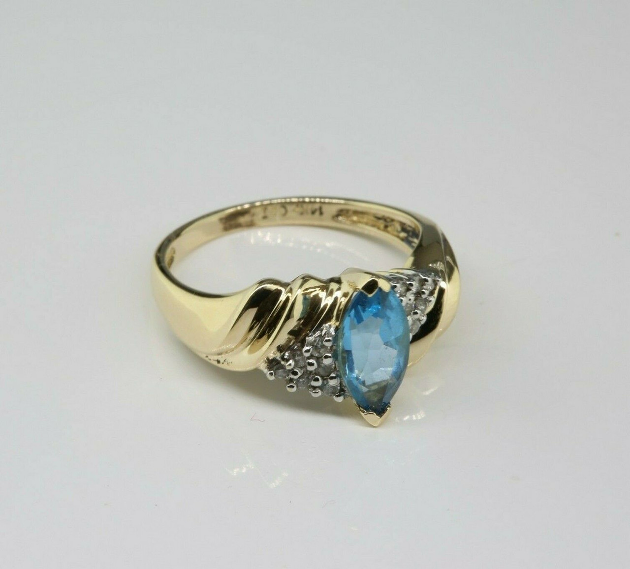 Blue topaz yellow gold on sale ring