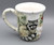 Certified International Winter Scene 4.25" Coffee Mug Racoon & Cardinals Front