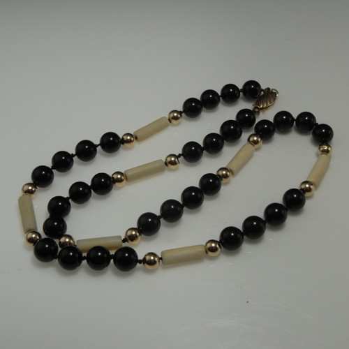 Art Deco ivory onyx and 14K gold necklace.