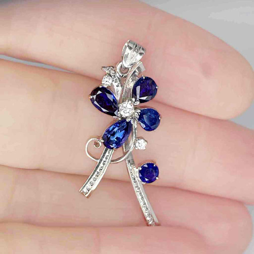 Unique unheated deep vibrant blue sapphire diamond flower pendant