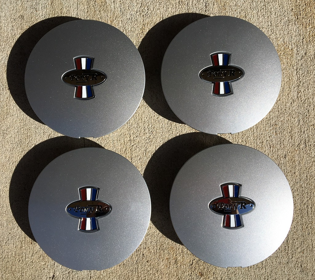 This is a set of 4 Pony R Parts, Pony R Wheel caps.  The finish is argent.  They will fit  Pony R wheels, and OEM Mustang pony wheels.  Excellent fit and finish!