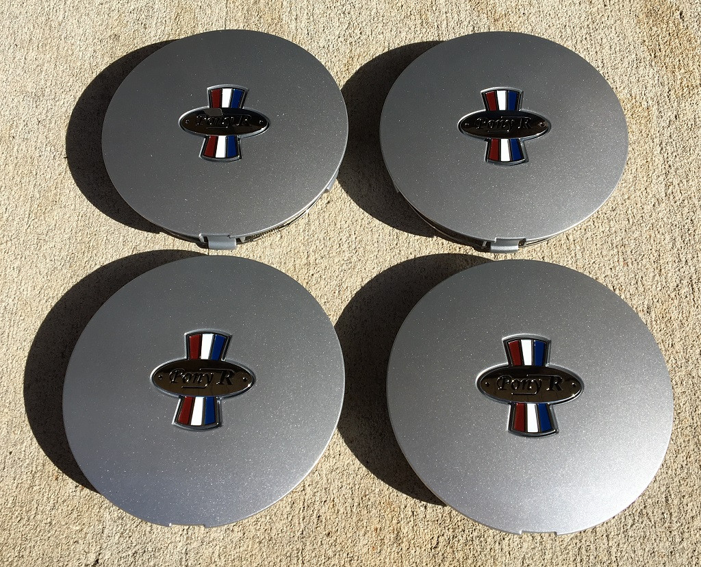 This is a set of 4 Pony R Parts, Pony R Wheel caps.  The finish is argent.  They will fit  Pony R wheels, and OEM Mustang pony wheels.  Excellent fit and finish!