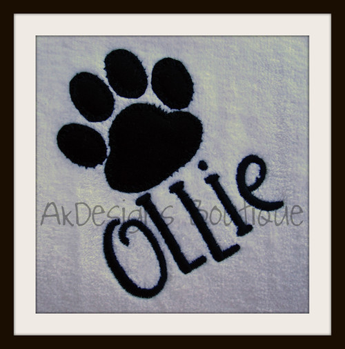 Stitched on a white towel with our #381 Doodle Font to spell "Ollie".
