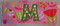 Close-up example of stitched uppercase applique "M" on our #514 Sippy Cup Template