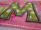 Picture of Sparse Satin Stitch template with the letter "M" from our #382 Funky Applique Font set [NOT included].