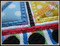 Close-up example of the Satin Stitch Sailboat with fabric.
Madeira Thread Colors Used:
#1683 Yellow
#1747 Red
#1775 Blue
#1800 Black