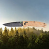 HO24459 4.38" (11.13cm) closed. 3.38" (8.59cm) black stonewash finish CPM MagnaCut stainless drop point blade. Lanyard hole. Pocket clip. Maple Valley Richlite handle. Green anodized titanium thumb studs.