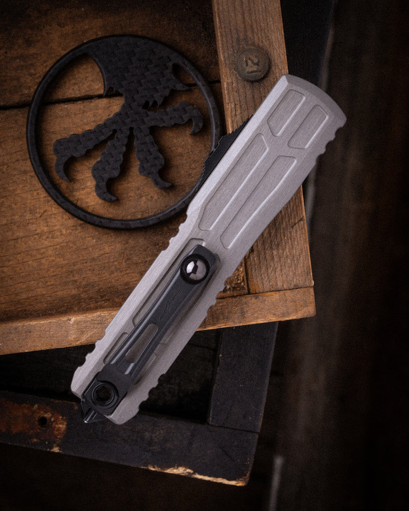 MCT1120EX1NCS Automatic opening. 5" (12.7cm) closed. 3.5" (8.89cm) two-tone finish premium steel blade. Gray aluminum handle. Lanyard hole. Glass breaker. Pocket clip. Bayonet style blade.
