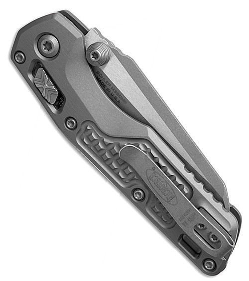 MCT210M10APFRNC 4.25" (10.8cm) closed. 3.25" (8.26cm) Apocalyptic finish Bohler M390MK stainless sheepsfoot blade. Gray frag pattern aluminum handle. Pocket clip. Lanyard hole. Thumb stud.