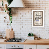 "Sit Long, Talk Much" in a white grooved frame, shown in a lifestyle setting