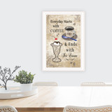 "Everyday Starts with Coffee" in a white, grooved frame with a nature style background, shown in a lifestyle setting
