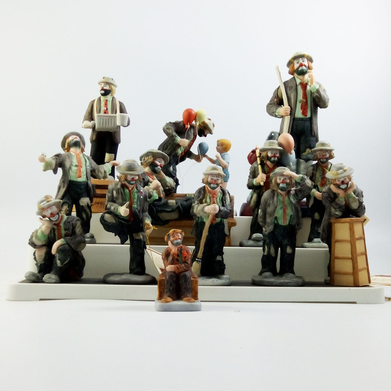 8 piece Collection of Emmett Kelly figurines /Decanter