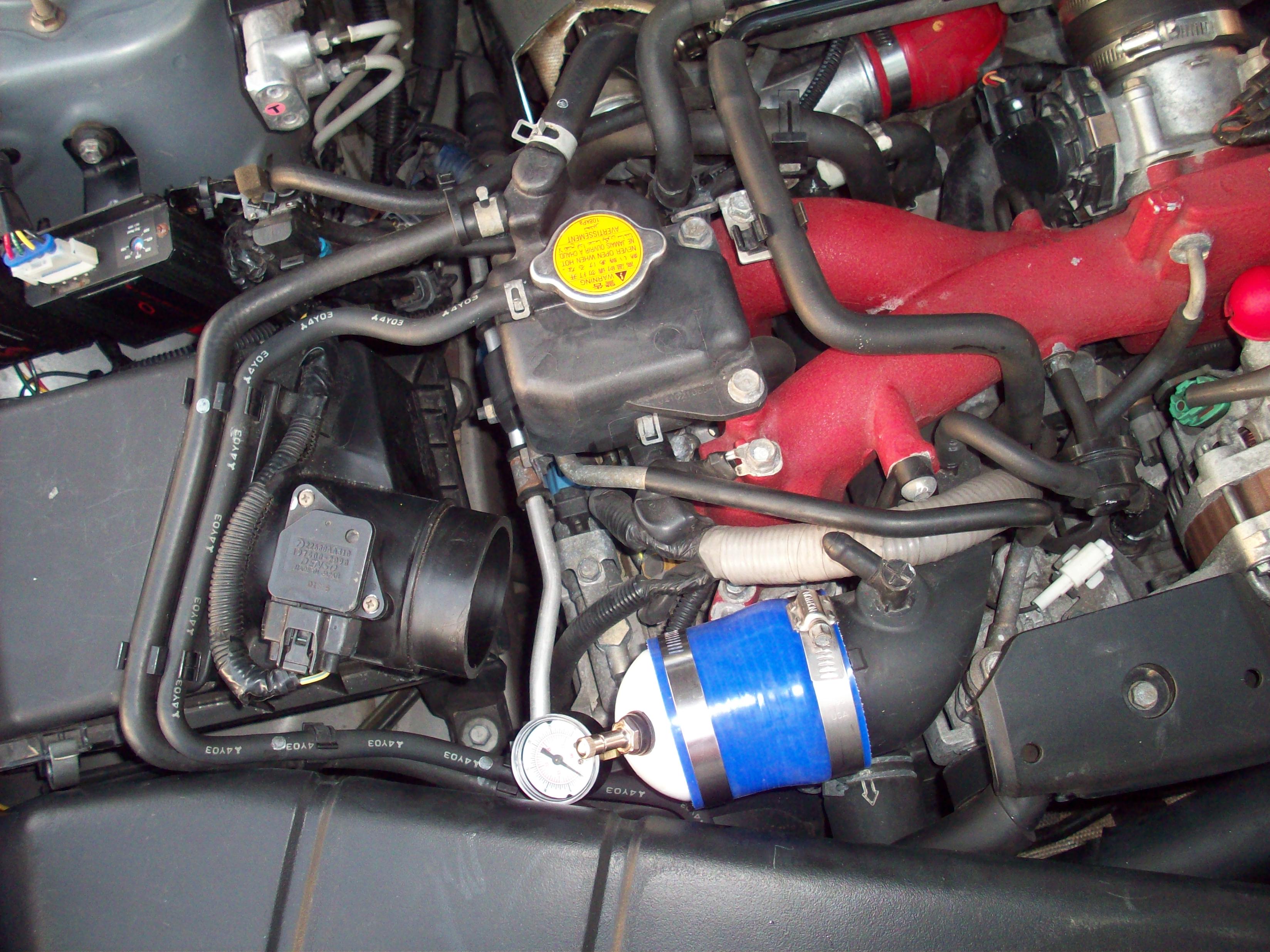 Boost leak tester installed on Subaru intake pipe