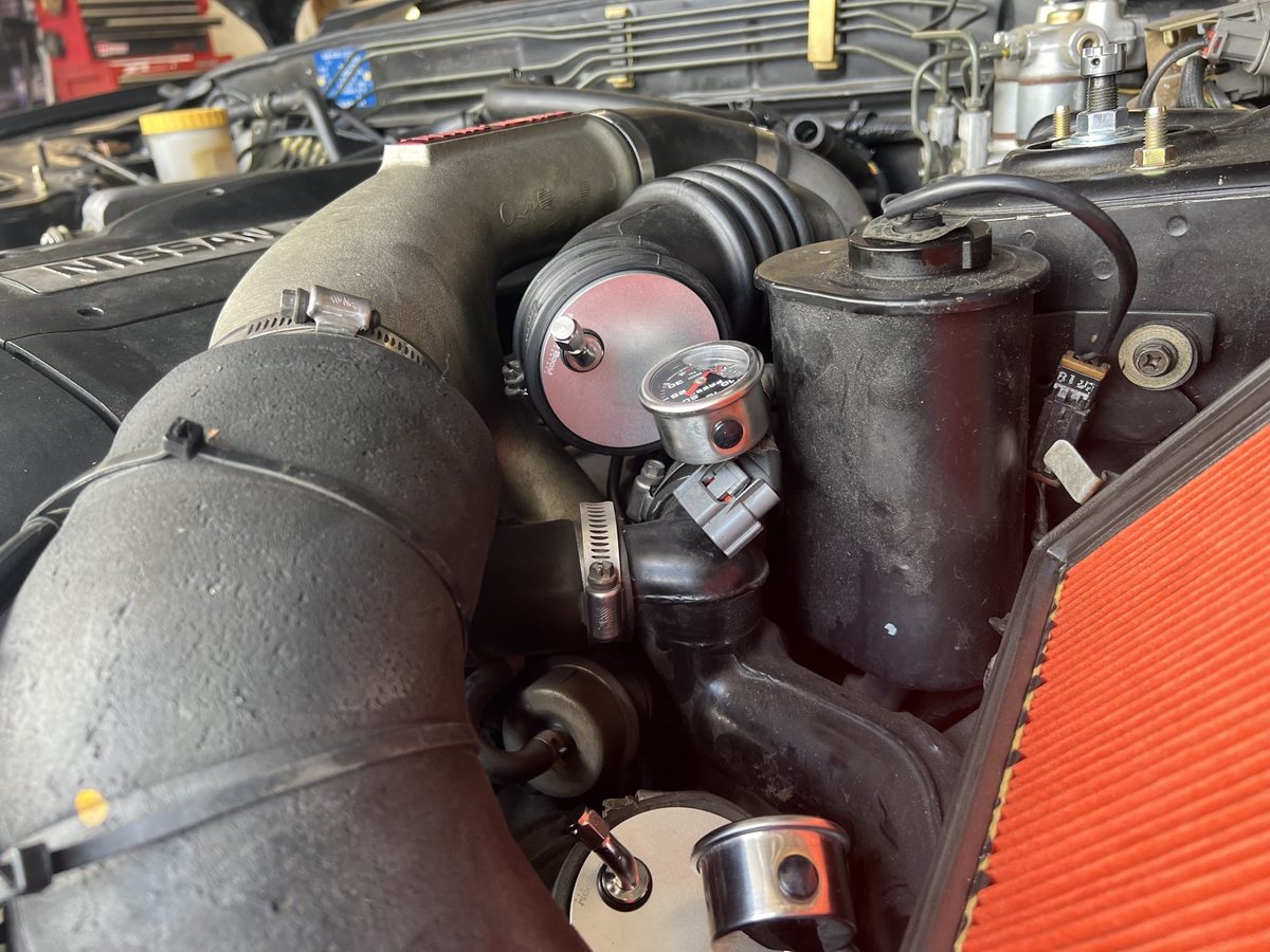 Billet tester and gauge installed on a Nissan RB26 intake
